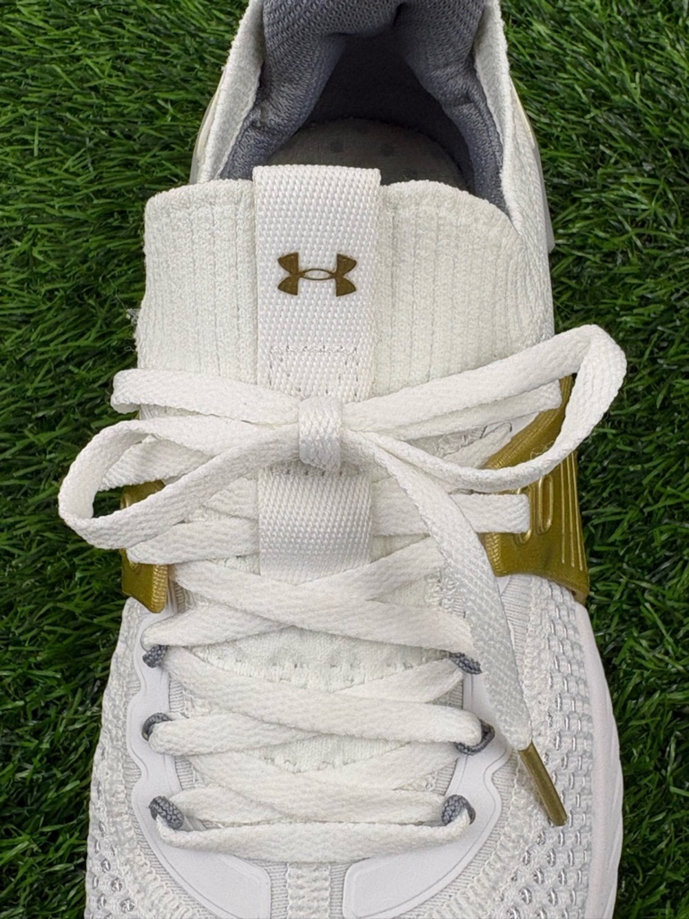 Under Armour Women’s HOVR Project Rock 4 Training Sneakers in White and Gold - Picture 9 of 12